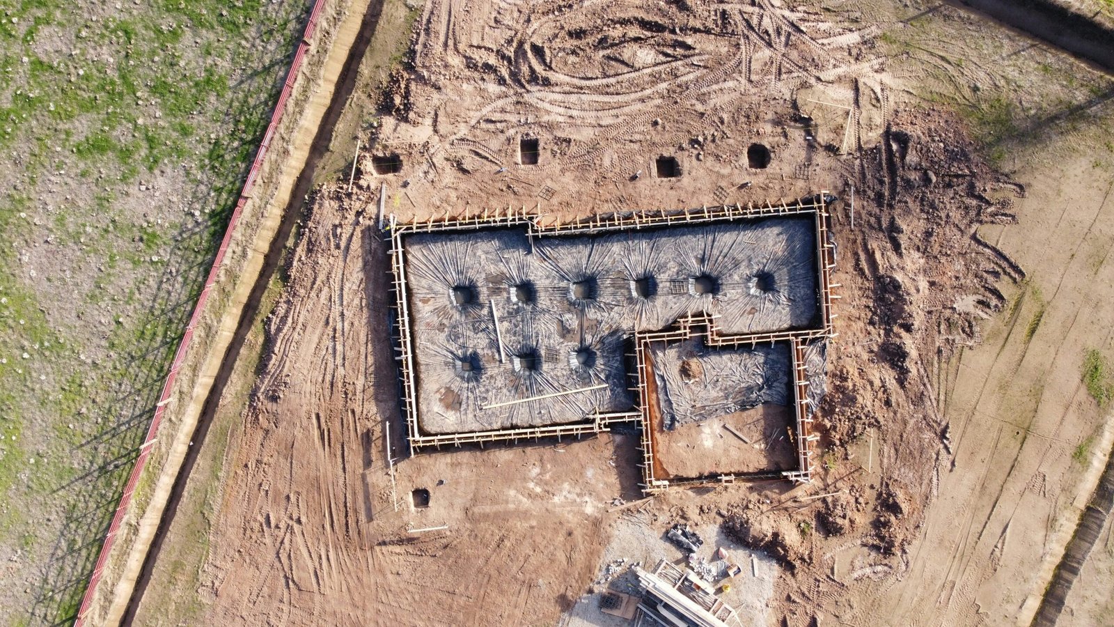 Hamilton Concreters residential concrete foundation site with boxed slab preparation and earthworks.