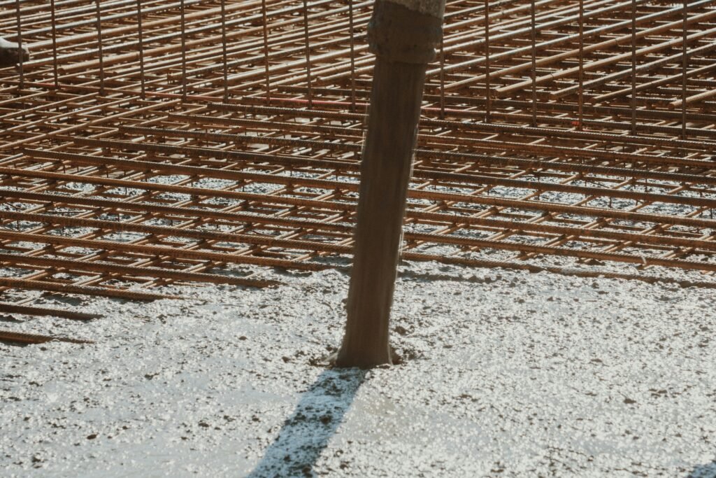 Hamilton Concreters pouring reinforced concrete house foundations with steel mesh rebar.